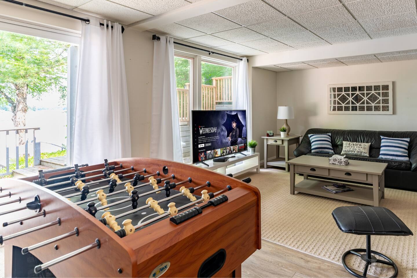 Private dock with red Muskoka chairs and calm lake waters