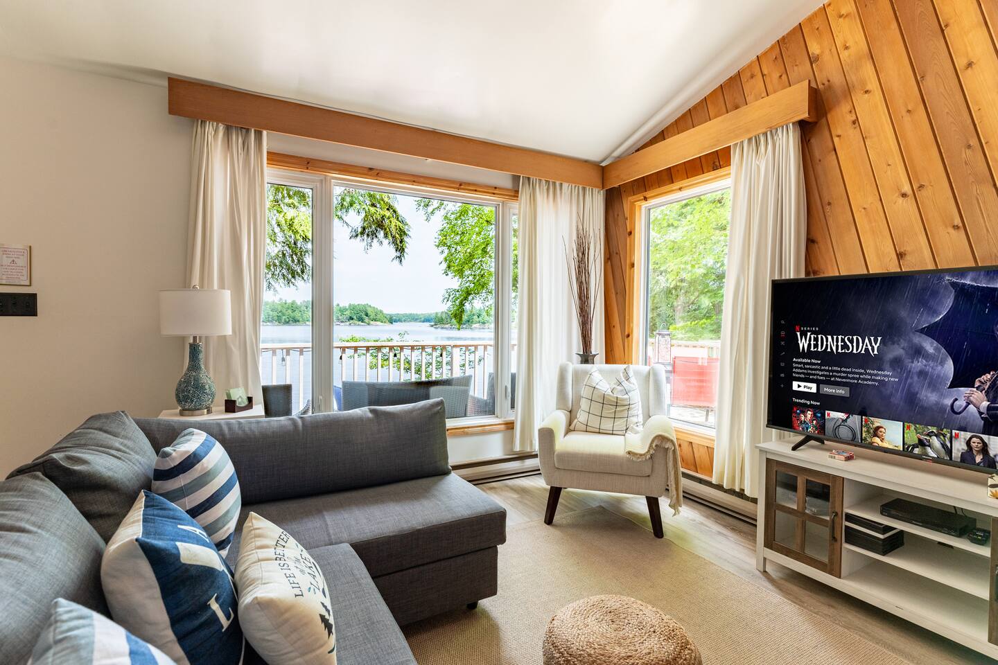 Master bedroom with queen bed and warm wood accents