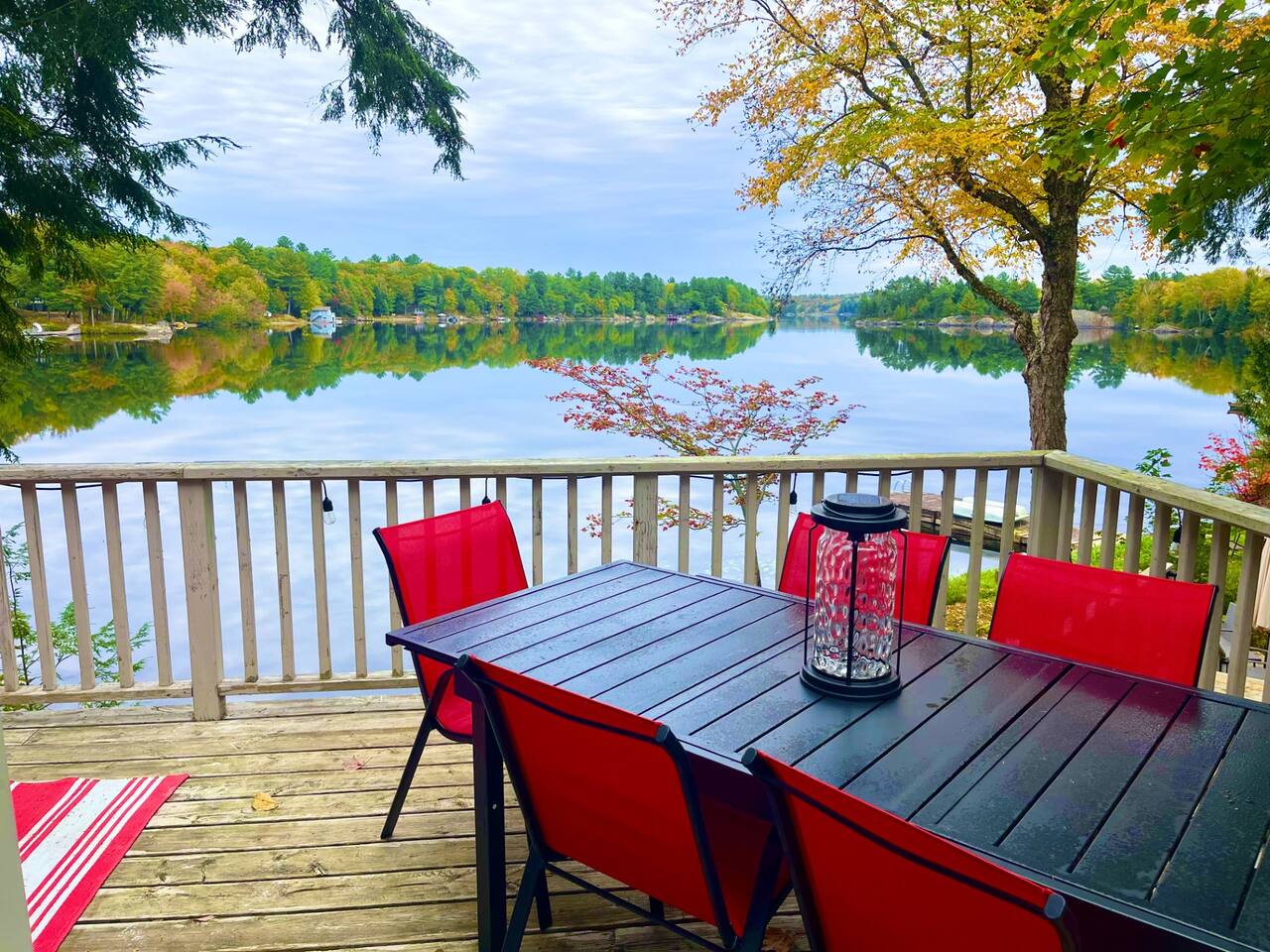 Lakefront with Muskoka chairs, umbrella and stunning water views